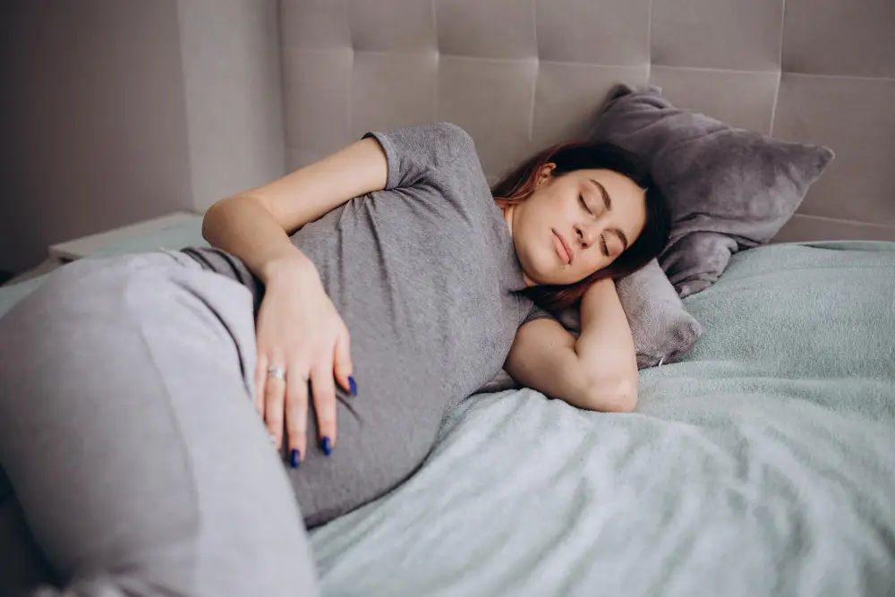 pregnancy rest people expectation concept happy pregnant woman sleeping bed home