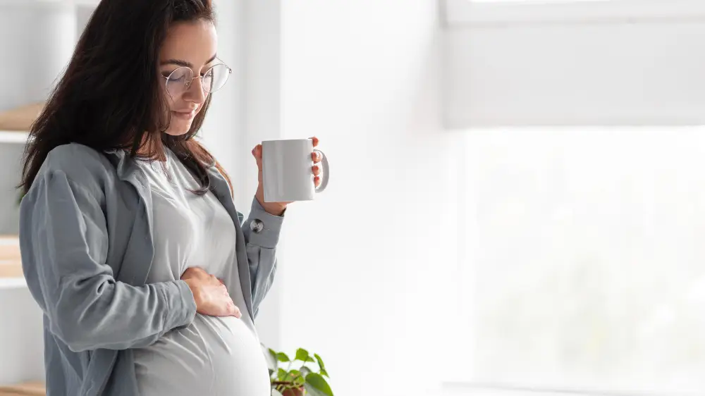 side view pregnant woman home with mug coffee